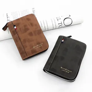 Close-up of stylish men's matte leather zip-around wallets with gold foil logo