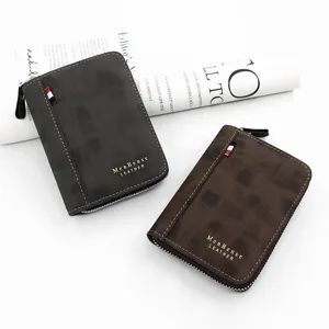 Detailed view of two men's matte textured zip-around wallets with gold lettering