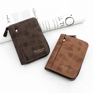 Detail view of men's matte brown zip-around wallets with gold lettering and textures