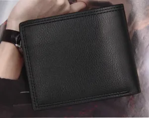 Close-up of black lychee grain leather texture on a men's short bifold wallet