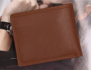 Close-up of brown leather men's bifold wallet showing detailed texture and stitching.