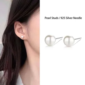 Close-up of elegant white pearl stud earrings with S925 silver needles for sensitive ears