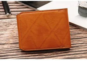 Close-up of tan men's leather bifold wallet with diamond-stitched pattern texture