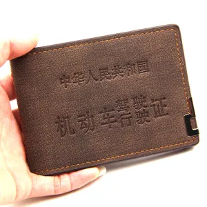 Professional brown leather vehicle license cover with embossed text and metal detail
