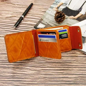Brown leather bifold wallet for men with multiple card slots and snap closures.