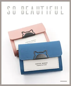 Detailed view of two color-block women's tri-fold wallets with cat-ear metal clasps