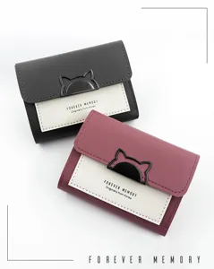 Close-up detail of minimalist women's short tri-fold wallets in black and pink leather