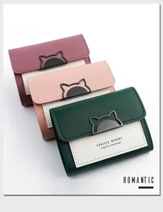 Detailed view of three Korean style trifold wallets with cute cat-ear metal clasps.