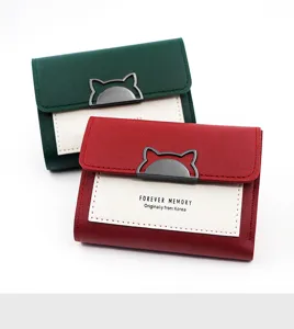 Detail view of Korean style minimalist tri-fold women's wallets in red and green