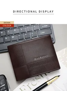Detail view of a brown minimalist men's business wallet with embossed lines and logo