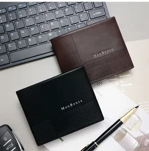 Detailed view of black and brown men's business wallets with embossed texture