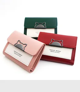 Detail of tri-fold women's wallets in various colors with cute cat ear clasp