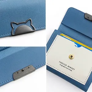 Stylish compact blue tri-fold women's wallet with cute cat-shaped clasp and multi-card slots