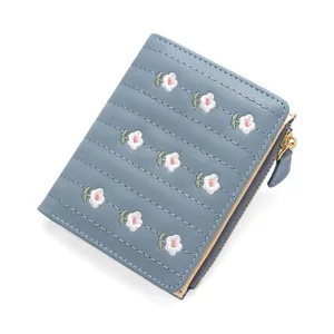 Elegant blue short wallet featuring floral embroidery and a zipper for cards