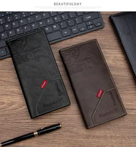Macro view of textured PU leather long wallets in black and brown on a desk