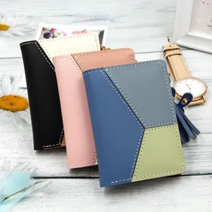 Stylish women's short wallet with geometric color block design and tassel zip detail