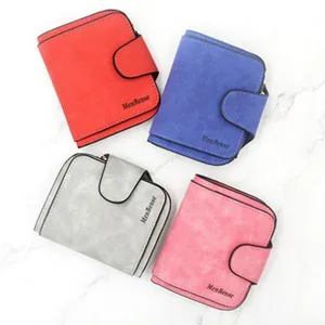 Detailed showcase of four colorful women's tri-fold wallets on a marble background