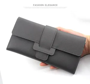Elegant dark grey tri-fold long wallet for women featuring a textured leather buckle closure