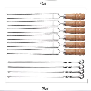 Stainless steel barbecue skewers set with wooden and metal handles for outdoor grilling.