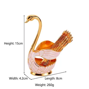 Elegant swan-shaped fruit fork set with gold-tone decorative holder for home decor