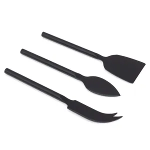 Detail view of 3-piece black stainless steel cheese knife and butter spreader tool set.