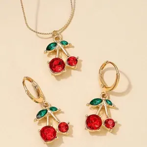 Close-up detail view of sweet red cherry crystal necklace and earrings jewelry set