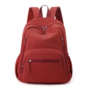 Sac à dos en nylon rouge léger et imperméable de grande capacité avec poches zippées