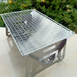 Detail view of a portable stainless steel foldable BBQ grill for outdoor camping