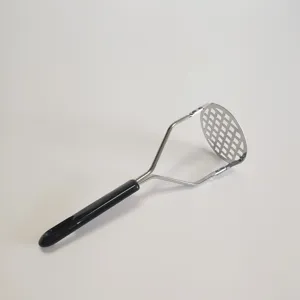 Stainless steel potato masher detail showing grid design and ergonomic black handle.