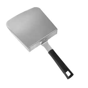 A detailed macro view of a large stainless steel fry scoop with an ergonomic black handle.