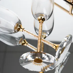 Detail of crystal champagne flute with elegant gold foil stem for wedding parties