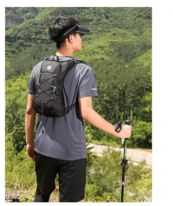 Asian male model wearing a lightweight black hydration running vest for outdoor hiking