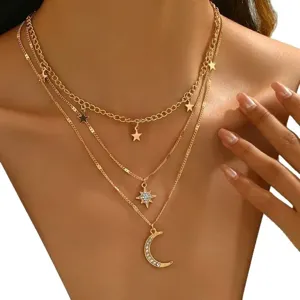 Elegant gold multi-layer necklace featuring sparkling rhinestone star and crescent moon pendants