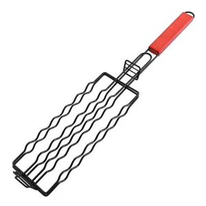 Detail of the black iron BBQ grilling basket with a heat-resistant red wooden handle.