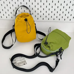 Lightweight camping crossbody bucket bags in vibrant yellow and green for outdoor cycling.