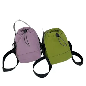 Lightweight purple and green outdoor bucket bags for camping and cycling crossbody use.