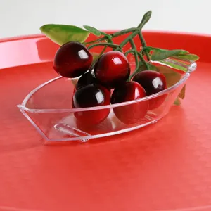 Detailed close-up of a clear teardrop-shaped PC salad bowl holding decorative cherries