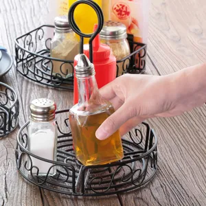 Sturdy black wrought iron condiment basket with menu clip for restaurant table use