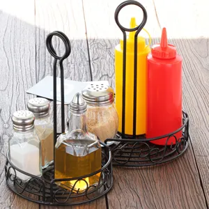Black iron seasoning rack with integrated table card holder for restaurant use