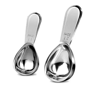 Stainless steel measuring spoons detail shot, showcasing 15ml and 30ml coffee scoop capacities.