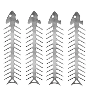 Detail of stainless steel fishbone-shaped BBQ skewers with integrated bottle opener