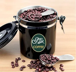 Stainless steel coffee canister with measuring spoon, airtight container for coffee beans.