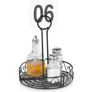 Detailed view of black iron condiment rack with integrated table number clip and glass bottles