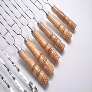 Stainless steel barbecue skewers with wooden handles, perfect for outdoor grilling meat.