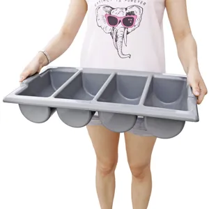Detail view of the gray plastic 4-compartment cutlery tray showing neat kitchen organizer.