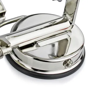 Stainless steel apple peeler base detail, showing polished finish and suction cup.