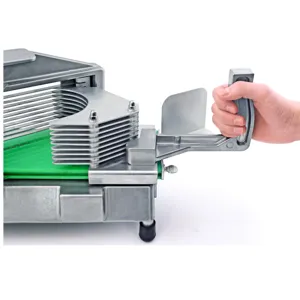 Commercial stainless steel fruit and vegetable slicer for uniform tomato and lemon slices.