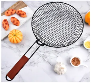 Foldable black wire mesh BBQ basket with wooden handle for outdoor cooking and grilling detail.