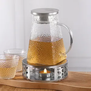 Chauffe-théière moderne en acier inoxydable avec théière en verre martelé et bougie