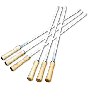 Stainless steel BBQ skewers with wooden handles for outdoor grilling and commercial use.